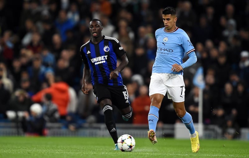 Joao Cancelo of Manchester City in action against Mohamed Daramy of Copenhagen during a Uefa Champions League Group G game in October 2022. EPA 