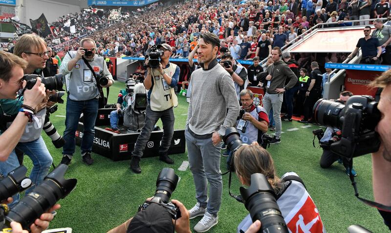 Frankfurt's head coach Niko Kovac is surrounded by cameras prior the German Bundesliga soccer match between Bayer Leverkusen and Eintracht Frankfurt in Leverkusen, Germany, Saturday, April 14, 2018. Kovac was announced as new Bayern head coach for next season. (AP Photo/Martin Meissner)