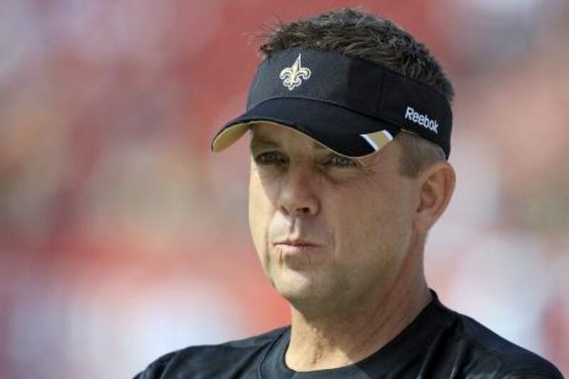 FILE - This Oct. 16, 2011 file photo shows New Orleans Saints head coach Sean Payton watching his team warm up for an NFL game against the Tampa Bay Buccaneers, in Tampa, Fla. NFL Commissioner Roger Goodell has rejected the appeals of coach Sean Payton and other New Orleans Saints officials stemming from the league's probe into the club's bounty system. After hearing from Payton, general manager Mickey Loomis and assistant head coach Joe Vitt last week, Goodell decided Monday, April 9, 2012,  to uphold his initial sanctions, which include Payton's suspension for the entire 2012 season. (AP Photo/Chris O'Meara, File) *** Local Caption ***  Saints Bounties Football.JPEG-0247f.jpg
