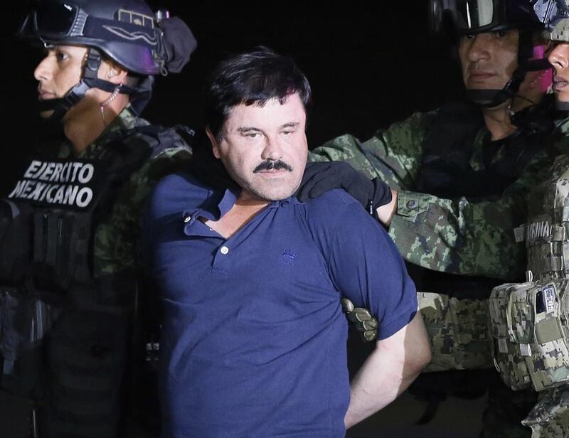 Joaquin 'El Chapo' Guzman is escorted by Mexican authorities to a helicopter in Sinaloa, Mexico after his arrest in Janurary 2016.  Jose Mendez / EPA 