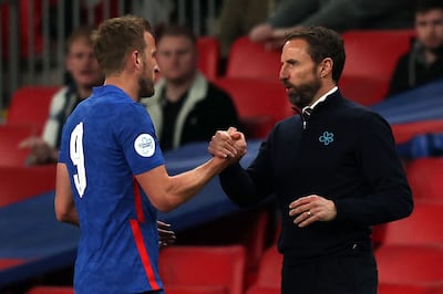 England's manager Gareth Southgate shakes hands with striker Harry Kane. AFP