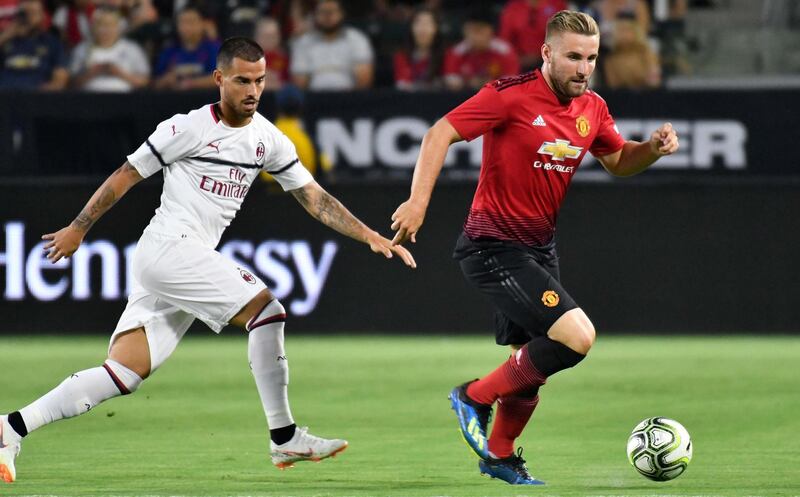 Jul 25, 2018; Carson , CA, USA; Manchester United defender Luke Shaw (23) moves the ball past Milan forward Suso (8) in the first half during an International Champions Cup soccer match at Stubhub Center. Mandatory Credit: Robert Hanashiro-USA TODAY Sports