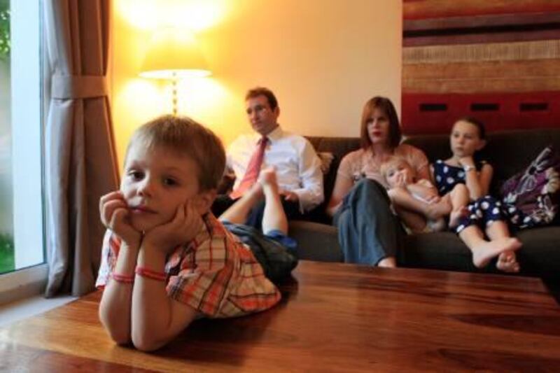 ABU DHABI - 16NOV2011 - WIlliam Whitcher (fore ground) 4 and half year old their son who has severe peanut allergy seen with his family, Abigail Whitcher 8 year old (right) Mom Rachel Whitcher, Dad Ashley Whitcher and Elizabeth Whitcher 2 year old at their residence in Al Reef Compound in Abu Dhabi. Ravindranath K / The National