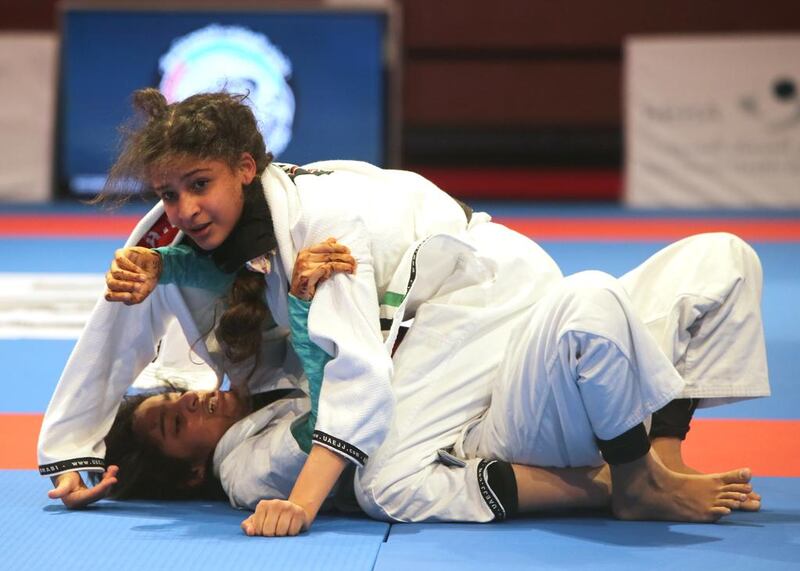 Fatima Al Marar of the UAE shown in her match with Asma Al Hosani (on top) of the UAE in the Abu Dhabi World Youth Jiu-Jitsu Championship 2016. Ravindranath / The National