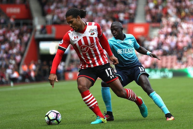 Virgil van Dijk of Southampton, left, is put under pressure from Modou Barrow of Swansea City. Bryn Lennon / Getty Images