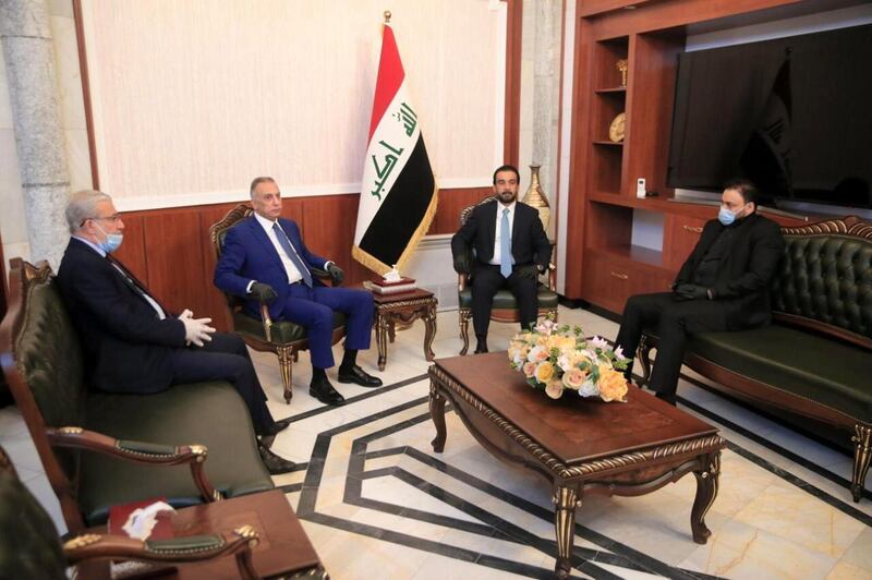 Iraqi minister Mohammed al-Halbousi meets with Iraqi Prime Minister-designate Mustafa al-Kadhimi before the vote on the new government at the parliament building in Baghdad, Iraq.  EPA