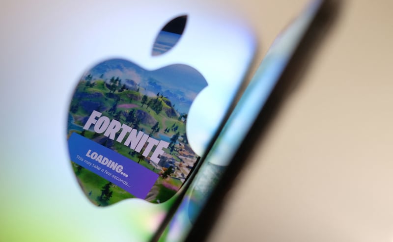 Fortnite's return to iPhones in the EU signifies a new era of app store competition. AFP