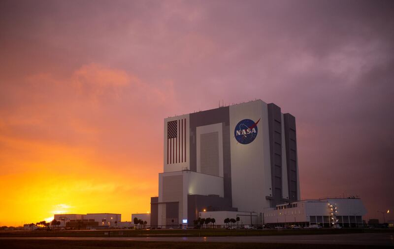 The sun sets behind the Vehicle Assembly Building. Reuters