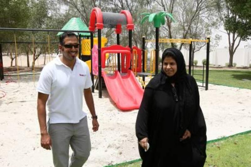 DUBAI, UNITED ARAB EMIRATES Ð July 19: Dr.Mona Al Bahar, Deputy CEO for Care & Community Services (right) and Mohamed Yacoob, Operational Manager of Swing City (left) after inaugurating the children play area at Dubai Foundation for Women and Children campus in Dubai. (Pawan Singh / The National) For News. Story by Hala
