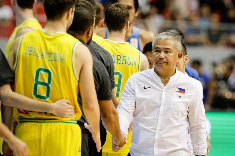 Head coach of the Philippines, Vincent Reyes right, shakes hands with Australian players. Mark R. Cristino / EPA