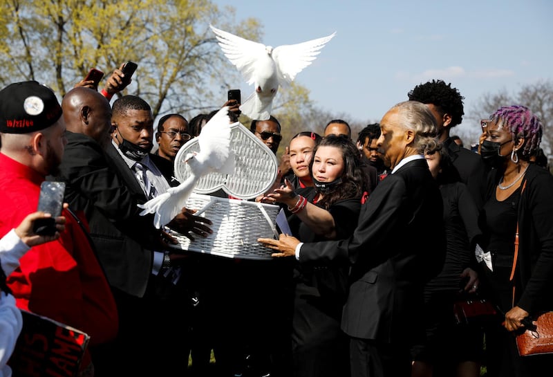 Katie Wright, the mother of Daunte Wright, a Black man who was fatally shot by a police officer after a routine traffic stop, accompanied by family members and Rev. Al Sharpton, releases doves during his funeral at Lakewood Cemetery, in Minneapolis, Minnesota, U.S. REUTERS
