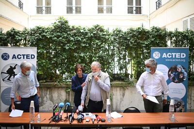 Members of the NGO Acted (from L) Frederic de Saint Cernin, co-founders Frederic Roussel  and Marie-Pierre Caley, and their lawyer Joseph Breham arrive to give a press conference in Paris, on August 10, 2020 following the death of eight people including French aid workers, killed by a gunman while visiting a part of Niger on August 9, 2020 that is popular with tourists for its wildlife. France's anti-terror prosecutor's office said August 10, 2020 it would probe the killing of eight people, including French aid workers, by gunmen in Niger. It would investigate charges of murder "with links to a terrorist enterprise" as well as "criminal terrorist association", the office said in a statement.
 / AFP / MARTIN BUREAU
