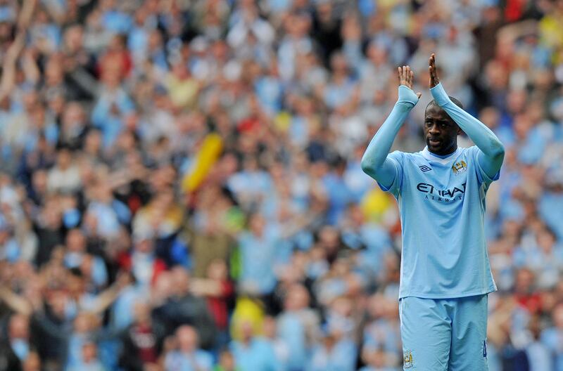 Manchester City's Yaya Toure applauds supporters at the Etihad Stadium. AFP