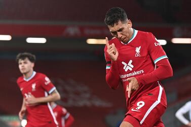 epa08836626 Roberto Firmino (R) of Liverpool celebrates after scoring the 3-0 during the English Premier League soccer match between Liverpool FC and Leicester City in Liverpool, Britain, 22 November 2020. EPA/Laurence Griffiths / POOL EDITORIAL USE ONLY. No use with unauthorized audio, video, data, fixture lists, club/league logos or 'live' services. Online in-match use limited to 120 images, no video emulation. No use in betting, games or single club/league/player publications.