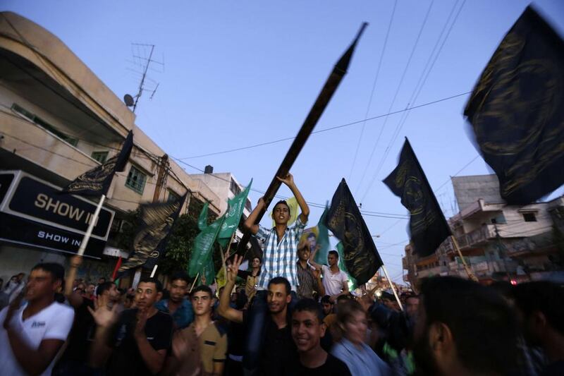 Mosques used their loudspeakers to broadcast celebratory chants of “God is greatest” as the war-torn enclave hailed the apparent end to seven weeks of violence. Mohammed Abed/AFP Photo