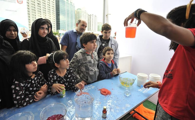 Visitors watch a science demostration at the Abu Dhabi Science Festival. Charles Crowell for The National