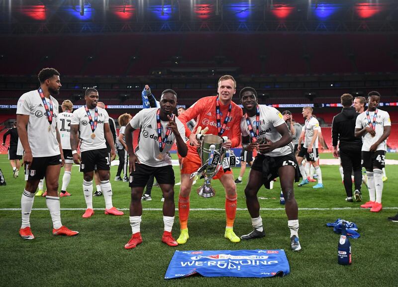 Neeskens Kebano, Marek Rodak and Aboubakar Kamara of Fulham celebrate with the trophy. Getty