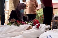 Palestinians search for loved ones among mass graves at Nasser Hospital