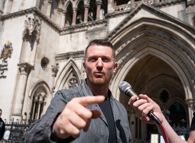Tommy Robinson speaks as he leaves the Royal Courts Of Justice in London, after appearing for a contempt of court hearing. PA