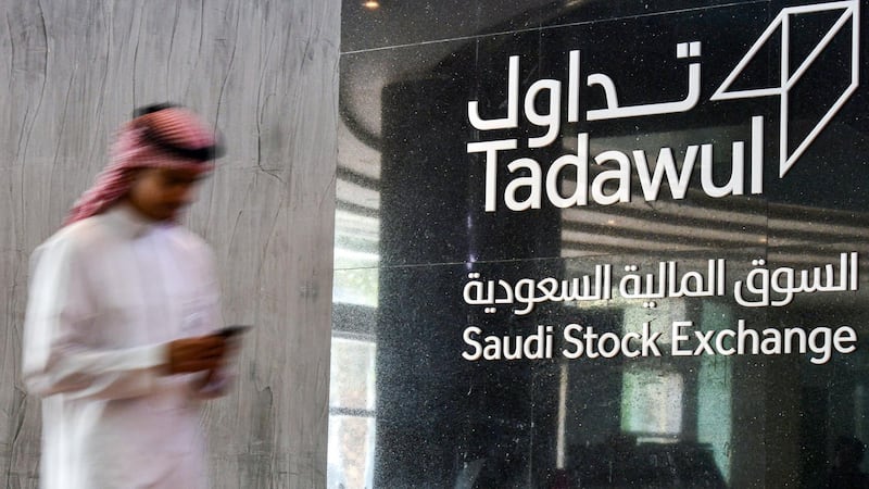 (FILES) This file photo taken on December 12, 2019, shows a view of the sign showing the logo of Saudi Arabia's Stock Exchange Market (Tadawul) bourse in the capital Riyadh. Saudi's stock exchange fell 6.5 percent, shares in oil giant Saudi Aramco dropped below their IPO price for their first time, and other Gulf markets tumbled to multi-year lows at the start of trading after OPEC and its allies failed to clinch a deal over oil production cuts. / AFP / FAYEZ NURELDINE
