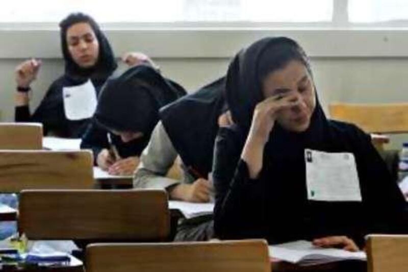 Iranian high school students sit for their university entrance examination in Tehran on June 25, 2009. Iran has jailed more than 140 political activists, journalists and university lecturers since the disputed election which returned President Mahmoud Ahmadinejad to power, reports said. AFP PHOTO/ISNA/MONA HOOBEHFEKR