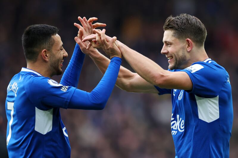 James Tarkowski celebrates with Dwight McNeil. Getty