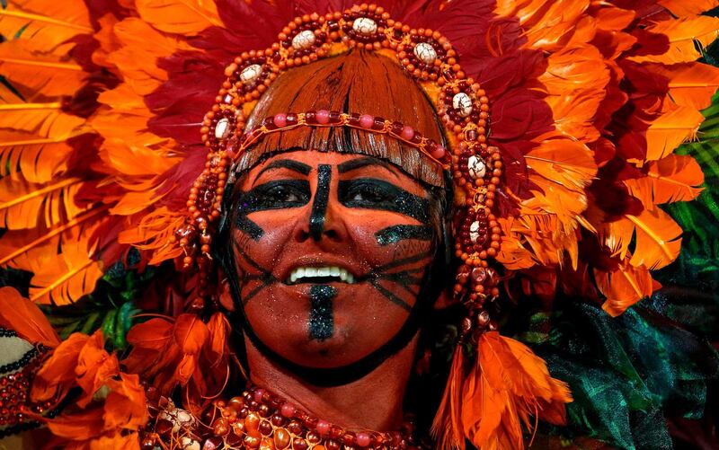 A reveller of the "Mocidade Alegre" samba school performs during the second night of carnival in Sao Paulo, Brazil. AFP