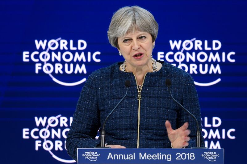 Britain's Prime Minister Theresa May addresses the Economic Forum (WEF) annual meeting on January 25, 2018 in Davos, eastern Switzerland. / AFP PHOTO / Fabrice COFFRINI