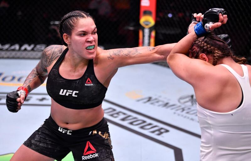Amanda Nunes punches Felicia Spencer in their UFC featherweight championship bout during UFC 250 at the UFC APEX. Reuters