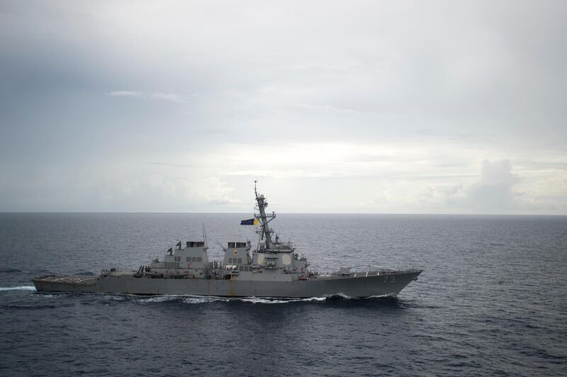 In this Oct. 13, 2016, photo provided by the U.S. Navy, guided-missile destroyer USS Decatur (DDG 73) operates in the South China Sea as part of the Bonhomme Richard Expeditionary Strike Group (ESG).  A Chinese destroyer came aggressively close to a U.S. Navy ship in the South China Sea, forcing it to maneuver to prevent a collision, the U.S. Pacific Fleet said Tuesday, Oct. 2, 2016, describing an encounter that could worsen tensions between the nations.  The Chinese warship approached the USS Decatur in an "unsafe and unprofessional maneuver" on Sunday near Gaven Reefs in the South China Sea, said U.S. Pacific Fleet Spokesman Lt. Cmdr. Tim Gorman. (Petty Officer 2nd Class Diana Quinlan/U.S. Navy via AP)