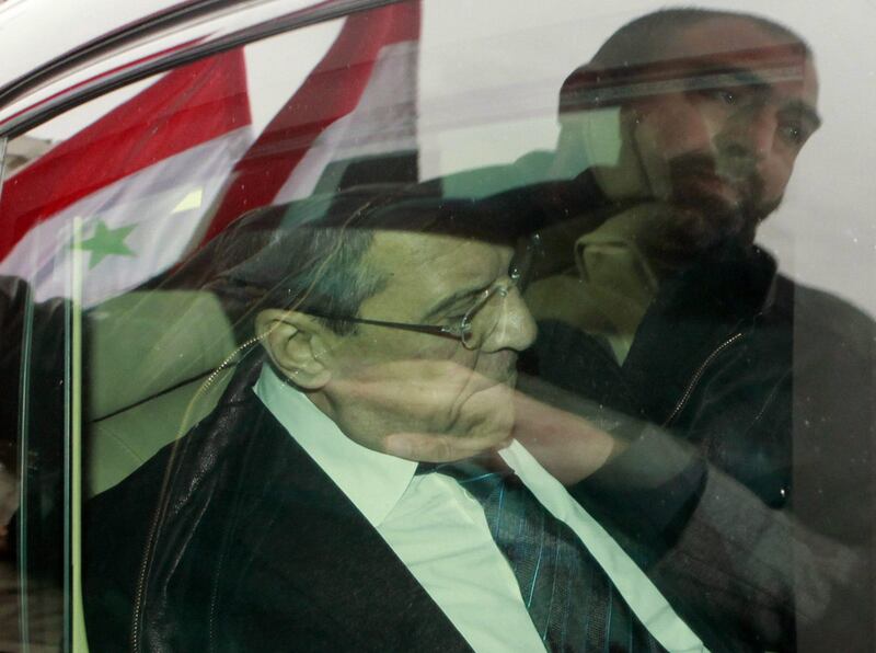 epa03095296 Syrian flags and a man are reflected on the window of the car carrying Russian Foreign Minister Sergei Lavrov as his motorcade drives to the presidential palace in Damascus, Syria, 07 February 2012. Lavrov arrived in Damascus for talks with Syrian President Bashar al-Assad. Thousands of Syrian government supporters gathered on the streets of Damascus to welcome Lavrov, and celebrate the Russian-Chinese double veto of a resolution on Syria at the United Nations Security Council.  EPA/YOUSSEF BADAWI CROPPED VERSION OF epa03095257 *** Local Caption ***  03095296.jpg