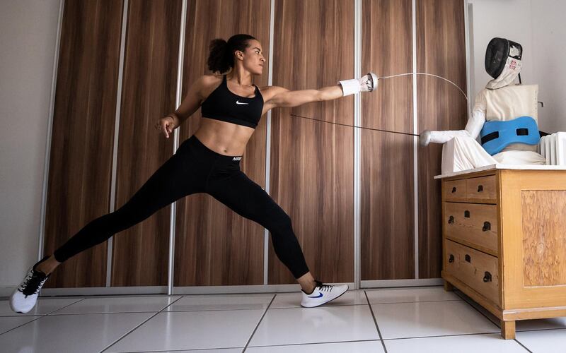 COLOGNE, GERMANY - APRIL 09: German epee fencer Alexandra Ndolo trains with a self made puppet in her apartment on April 09, 2020 in Cologne, Germany. Ndolo normally trains with a coach and team mates, but due to the lockdown she, like many professional athletes, is having to improvising training sessions to stay fit. The Coronavirus (COVID-19) pandemic has spread to many countries across the world, claiming over 70,000 lives and infecting over 1 million people. (Photo by Lars Baron/Bongarts/Getty Images)