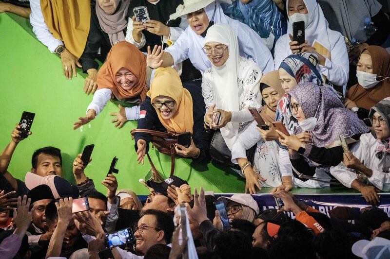 Supporters of Indonesian presidential candidate Anies Baswedan clamour to take photos of him at his campaign rally in Serang. AFP