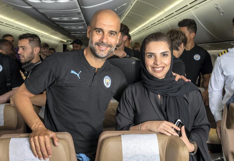 Manchester City manager Pep Guardiola with Amina Taher, Etihad Aviation Group's vice president of corporate affairs on the aircraft chartered for the club's flight to China from Abu Dhabi. Photo by Etihad Airways