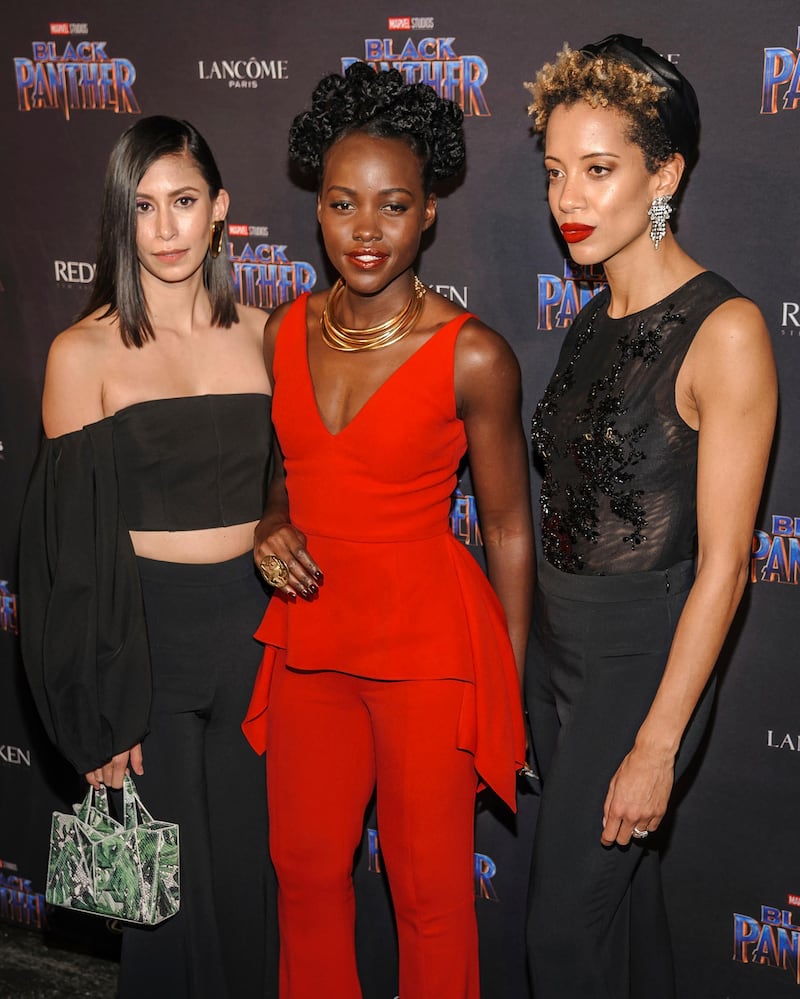 Michelle Ochs, from left, Lupita Nyong'o, and Carlie Cushnie Christopher Smith / Invision / AP