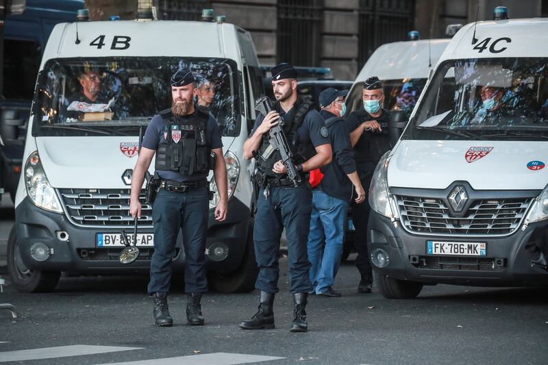 French police officers secure the courthouse before the arrival of the convoy transporting Abdeslam. EPA