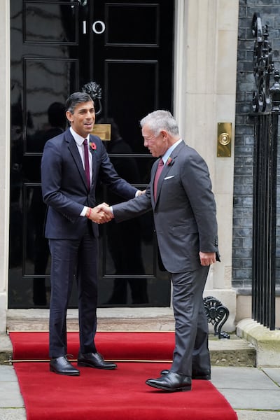 British Prime Minister Rishi Sunak shakes hands with King Abdullah II outside No 10 Downing Street. Reuters
