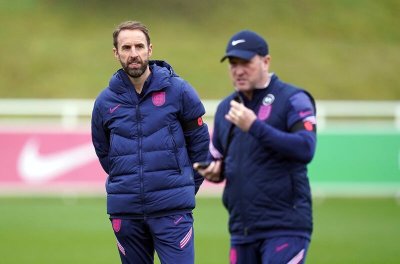 England manager Gareth Southgate and assistant Steve Holland, right. PA