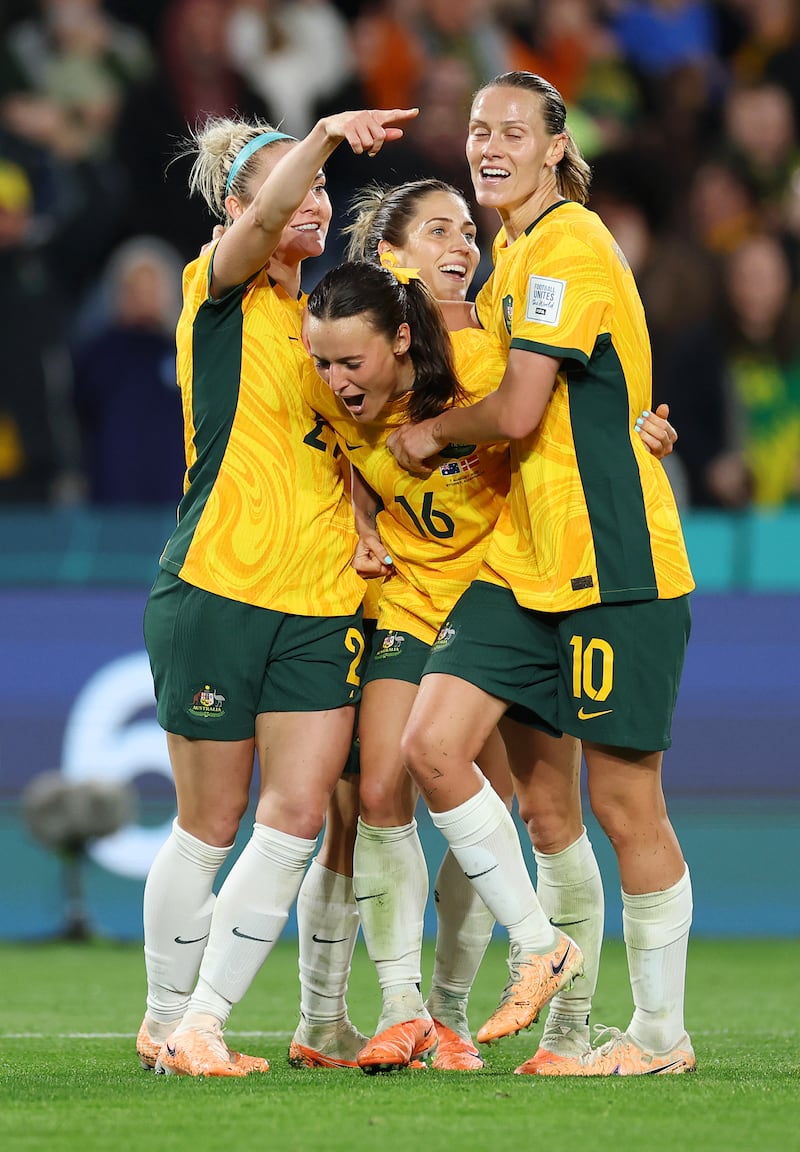 Hayley Raso (centre) of Australia celebrates with teammates after scoring her team's second goal. Getty