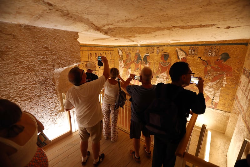 Tourists visit the tomb. EPA