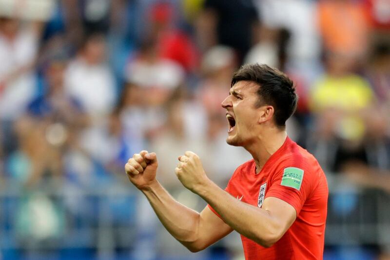 England's Harry Maguire celebrates victory of his team over Sweden at the end of the quarterfinal match between Sweden and England at the 2018 soccer World Cup in the Samara Arena, in Samara, Russia, Saturday, July 7, 2018. (AP Photo/Matthias Schrader )