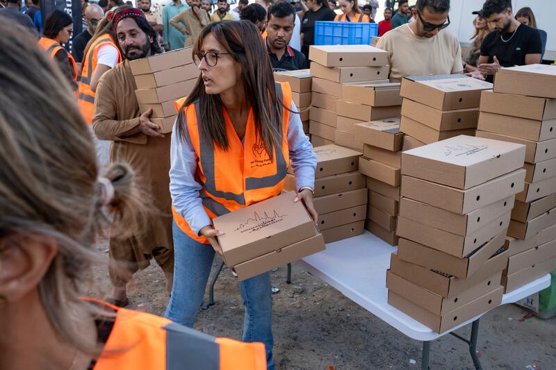 Meals are sorted for workers ready to break their Ramadan fasts. Antonie Robertson / The National
