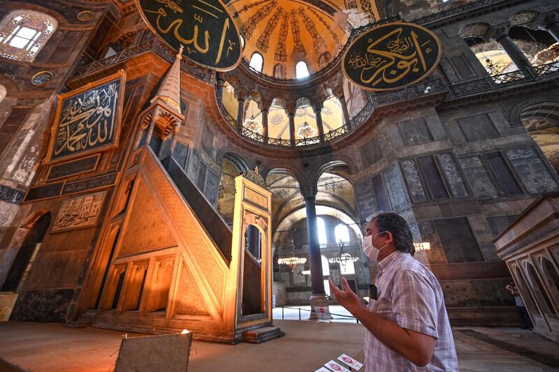 A Turkish visitor prays in Hagia Sophia museum in Istanbul. Turkey’s top administrative court announced its decision to revoke the 1,500-year-old former cathedral’s status as a museum.   AFP