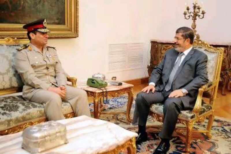 Egypt’s new defence minister Abdul-Fatah Al Sessi (left) meets with Egyptian President Mohammed Morsi. Mr Morsi’s new chief of staff, Sidki Sobhi, recommended the permanent withdrawal of the US military from the region in 2005.