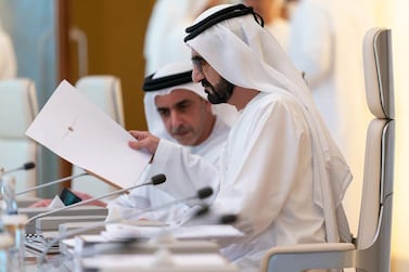 Sheikh Mohammed bin Rashid, Prime Minister and Ruler of Dubai, looks over the new national wellbeing strategy with Sheikh Saif bin Zayed, Deputy Prime Minister and Minister of Interior. Courtesy Dubai Media Office