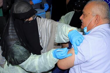 Civil service minister Abdul-Nasser Al Wali, receives the AstraZeneca vaccine at a medical centre in Aden. Reuters