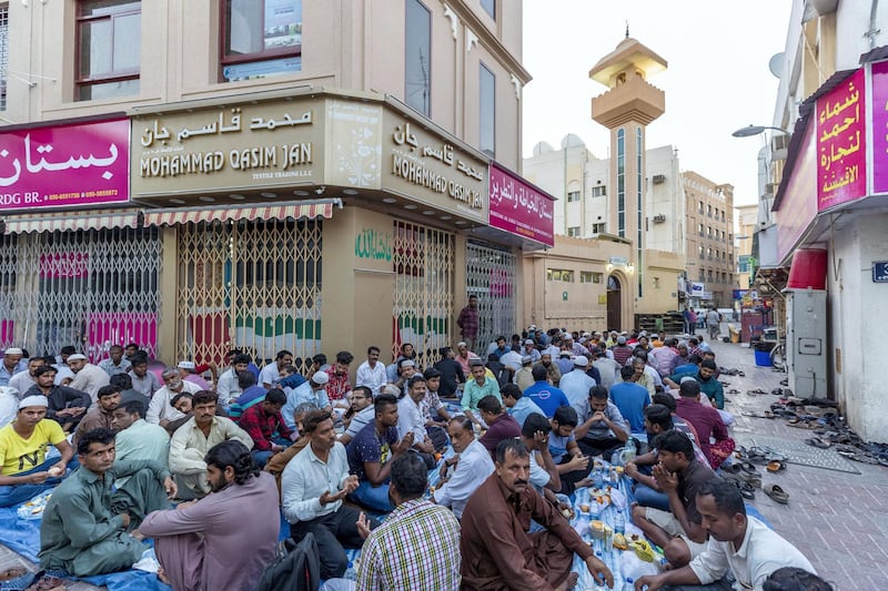 Dubai, United Arab Emirates - May 16, 2019: People prepare for Iftar. Mosque series for Ramdan. Lootah Masjid Mosque is an old mosque in Deira. Thursday the 16th of May 2019. Deira, Dubai. Chris Whiteoak / The National