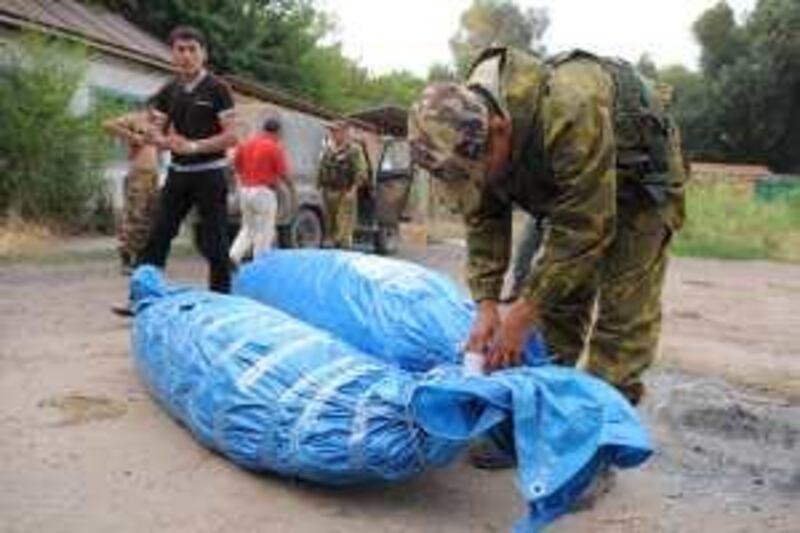 AUGUST 2009, CHU VALLEY, KAZAKHSTAN: Scene from the Chu Valley in Kazakhstan.photo shows police wrapping up seized cannibs plants after a raid Alexander Kantsedalov for The National *** Local Caption ***  AK-Chu5.JPG