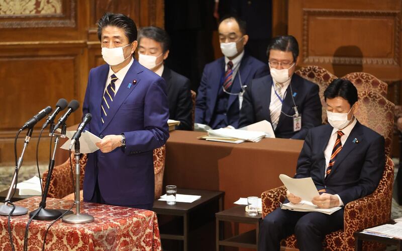 Japan's Prime Minister Shinzo Abe delivers a report to committee members of the Lower House in Tokyo on April 7, 2020 before declaring a state of emergency. AFP
