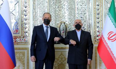 Iran's Foreign Minister Mohammad Javad Zarif and Russia's Foreign Minister Sergei Lavrov bump elbows while meeting in Tehran, Iran April 13, 2021. Iran's Foreign Ministry/WANA (West Asia News Agency)/Handout via REUTERS   ATTENTION EDITORS - THIS IMAGE HAS BEEN SUPPLIED BY A THIRD PARTY